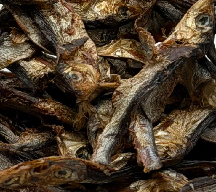The Barking Spot wild-caught Icelandic sprats dog treats in pouch with whole air-dried sprats displayed in front